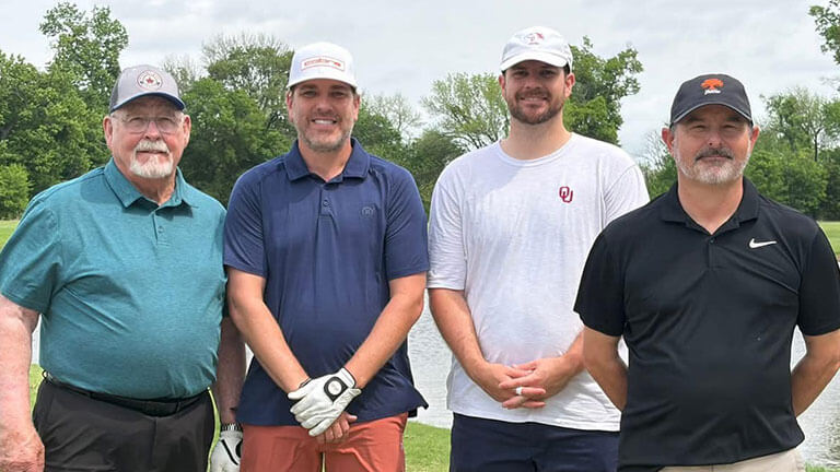 Golfers posing at the Salvation Army Golf Tournament in Shawnee, Oklahoma.