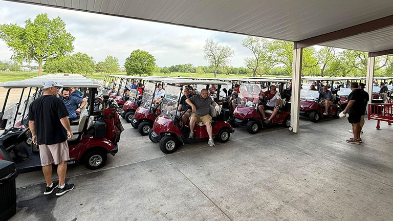Golf carts lined up before the start of the Salvation Army Golf Tournament in Shawnee, Oklahoma.